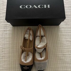 Coach Aubree Black and Tan Mary Jane’s